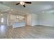 Open concept floor plan with hardwood floors throughout and a kitchen island at 4534 Eastbrook Pl, Snellville, GA 30039