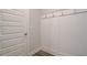 Mudroom with board and batten trim, coat hooks, and luxury vinyl plank flooring at 4534 Eastbrook Pl, Snellville, GA 30039