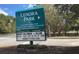 Lenora Park sign with upcoming events, set against a backdrop of lush trees at 4534 Eastbrook Pl, Snellville, GA 30039