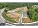 An aerial view of new construction homes with premium lots, landscaping, and trees surrounding the community at 4659 Larkfield Way, Powder Springs, GA 30127