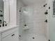 Modern bathroom featuring a glass enclosed shower with white marble tiling at 4659 Larkfield Way, Powder Springs, GA 30127