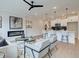 Open concept living room with modern fireplace and breakfast bar area at 4659 Larkfield Way, Powder Springs, GA 30127
