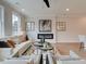 Bright living room featuring a modern fireplace, plush seating, and stylish decor at 4659 Larkfield Way, Powder Springs, GA 30127