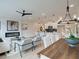 Open concept living and dining space with hardwood floors and ample lighting at 4659 Larkfield Way, Powder Springs, GA 30127