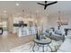 Open living space showcases kitchen island with seating, and a living area with fireplace at 4659 Larkfield Way, Powder Springs, GA 30127