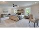 Spacious main bedroom featuring plush carpet, natural light, and ample seating at 4659 Larkfield Way, Powder Springs, GA 30127