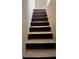 Interior shot of a staircase needing repairs at 700 W College St, Bowdon, GA 30108