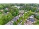 Scenic aerial view of homes near a beautiful lake surrounded by lush greenery and mature trees at 7979 Larksview Dr, Fairburn, GA 30213