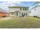 Large backyard with grass and privacy fence at 7979 Larksview Dr, Fairburn, GA 30213