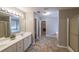 Bathroom with double sink vanity and shower with glass door at 7979 Larksview Dr, Fairburn, GA 30213