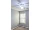 A standard bedroom with carpet flooring, neutral wall paint, and a window for natural light at 7979 Larksview Dr, Fairburn, GA 30213