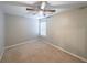 A standard bedroom with carpet flooring, neutral wall paint, and a window for natural light at 7979 Larksview Dr, Fairburn, GA 30213