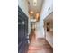 Bright foyer featuring hardwood floors, a staircase to the second floor, and high ceilings at 7979 Larksview Dr, Fairburn, GA 30213