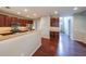 Well-equipped kitchen featuring wooden cabinets, stainless steel appliances, and open view to the home's entryway at 7979 Larksview Dr, Fairburn, GA 30213