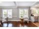 Open dining room with hardwood floors that flows into the kitchen at 949 Hope Sw Dr, Atlanta, GA 30310