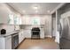 Modern kitchen with stainless steel appliances and granite countertops at 949 Hope Sw Dr, Atlanta, GA 30310