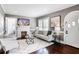 Stylish living room with fireplace, hardwood floors, and arched doorway at 949 Hope Sw Dr, Atlanta, GA 30310