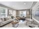 Inviting living room featuring recessed lighting, neutral decor, and large windows at 949 Hope Sw Dr, Atlanta, GA 30310