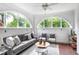 Inviting sunroom with arched windows, offering plenty of natural light at 949 Hope Sw Dr, Atlanta, GA 30310