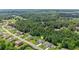 An aerial view of a well-manicured home nestled in a serene wooded neighborhood at 125 Registry Ln, Canton, GA 30115