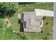 Aerial view of the house with large lot, patio, mature trees and expansive driveway at 125 Registry Ln, Canton, GA 30115