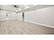 Spacious basement with light wood-look flooring, great ceiling height and white baseboards at 125 Registry Ln, Canton, GA 30115