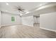Finished basement with recessed lights, ceiling fan, and light wood-look flooring at 125 Registry Ln, Canton, GA 30115