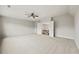 Spacious bedroom with carpet, ceiling fan, and a view of the staircase at 125 Registry Ln, Canton, GA 30115