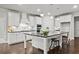 Contemporary kitchen with white cabinetry, granite countertops, and a large island with bar seating at 125 Registry Ln, Canton, GA 30115