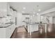 Bright kitchen with modern appliances, a large island, and seamless transition to the living area at 125 Registry Ln, Canton, GA 30115