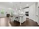 Modern kitchen with a central island, white cabinets, stainless steel appliances, and hardwood floors at 125 Registry Ln, Canton, GA 30115