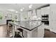 Stylish kitchen featuring a large island, modern appliances, and open view to a cozy living space at 125 Registry Ln, Canton, GA 30115