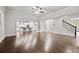 Spacious living room with hardwood floors, connecting to the kitchen and staircase at 125 Registry Ln, Canton, GA 30115