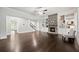 Bright, open living room featuring a stone fireplace, built-in shelves, and hardwood floors at 125 Registry Ln, Canton, GA 30115