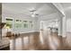 Spacious open-concept living area showcasing hardwood floors and kitchen access at 125 Registry Ln, Canton, GA 30115