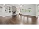 Spacious living room features a stone fireplace, built-in bookshelves, and natural light at 125 Registry Ln, Canton, GA 30115