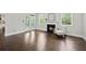 Bright living room with a fireplace, patio access, hardwood flooring, and comfortable seating at 125 Registry Ln, Canton, GA 30115