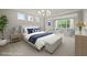 Virtually staged bedroom with calming gray tones, plush bedding, and a sitting area at 125 Registry Ln, Canton, GA 30115