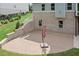 A view of a large patio with a brick wall on a well-maintained property at 125 Registry Ln, Canton, GA 30115