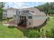 Back of the house with walk out basement, deck, and outdoor patio and basketball court at 125 Registry Ln, Canton, GA 30115