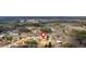 Aerial view displaying the home's position within a neighborhood with wooded areas and other homes at 19 Bridgemill Dr, Douglasville, GA 30134