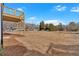 Spacious backyard with large trees and partial view of wooden deck above at 19 Bridgemill Dr, Douglasville, GA 30134
