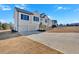 New two-story home with white siding, black shutters, a two-car garage, and ample parking space at 19 Bridgemill Dr, Douglasville, GA 30134
