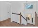Elegant foyer featuring hardwood floors, stairs with decorative railings, and natural light at 19 Bridgemill Dr, Douglasville, GA 30134