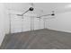 Spacious two car garage with concrete floor and two garage door openers at 19 Bridgemill Dr, Douglasville, GA 30134