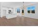 Open-concept kitchen featuring white cabinets, an island with a sink, and modern appliances at 19 Bridgemill Dr, Douglasville, GA 30134