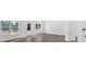 Bright living room with natural light, hardwood floors, and large windows overlooking nature at 19 Bridgemill Dr, Douglasville, GA 30134