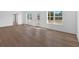 Bright living room featuring beautiful flooring, white walls and lots of natural light at 19 Bridgemill Dr, Douglasville, GA 30134