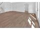 Bright living room featuring beautiful flooring, white walls and lots of natural light at 19 Bridgemill Dr, Douglasville, GA 30134