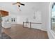 Open floor plan with stone fireplace and modern kitchen and living area at 19 Bridgemill Dr, Douglasville, GA 30134